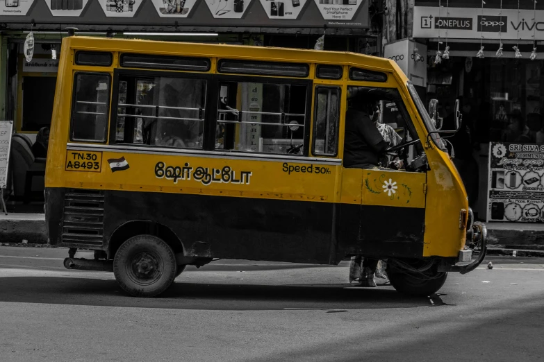 a yellow bus on the street in the daytime