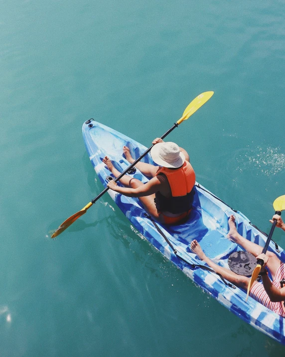 the people are riding in the canoe together