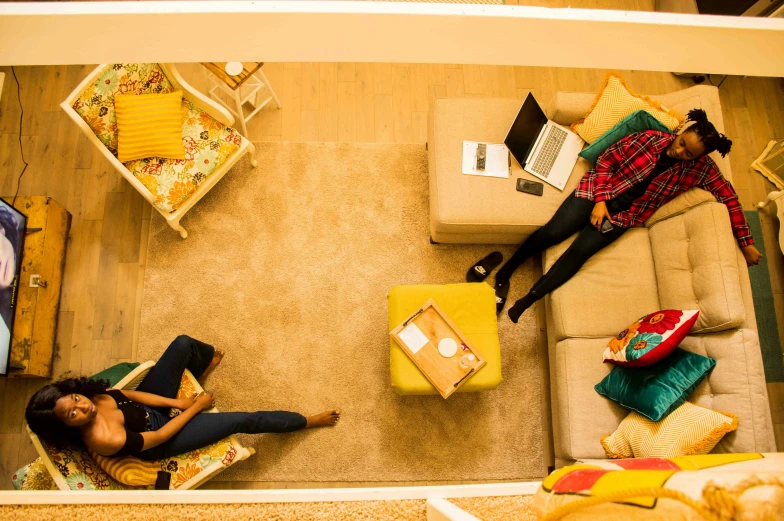 a woman sitting on the floor of a living room