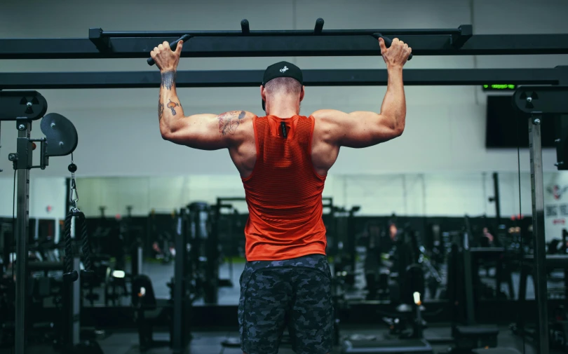 a person hanging upside down in the gym