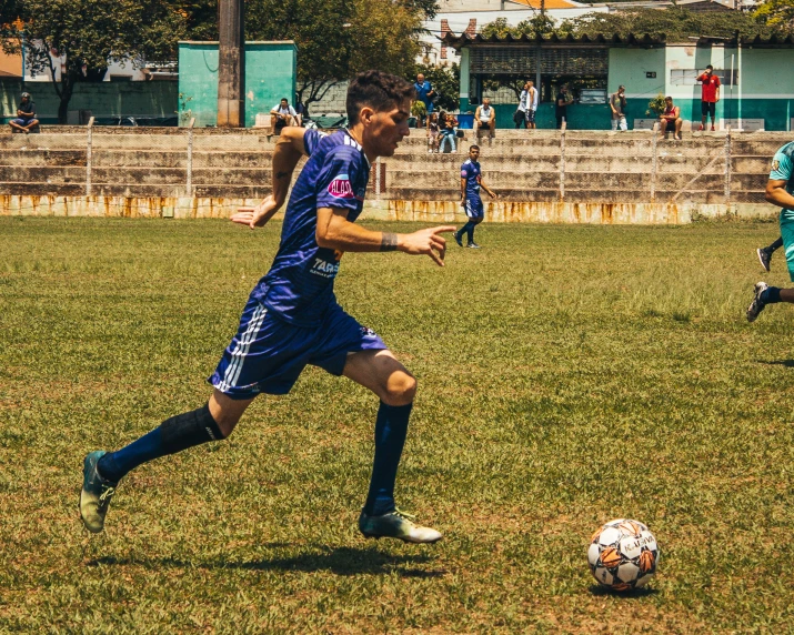 this is an image of a group of men playing soccer