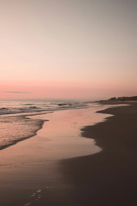 a po taken on a beach with water and sand