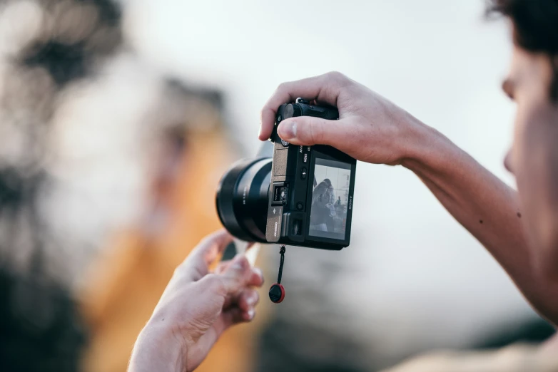 a woman taking a po with her camera