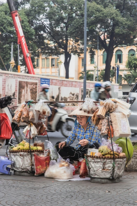 two baskets with fruits are shown in front of some people