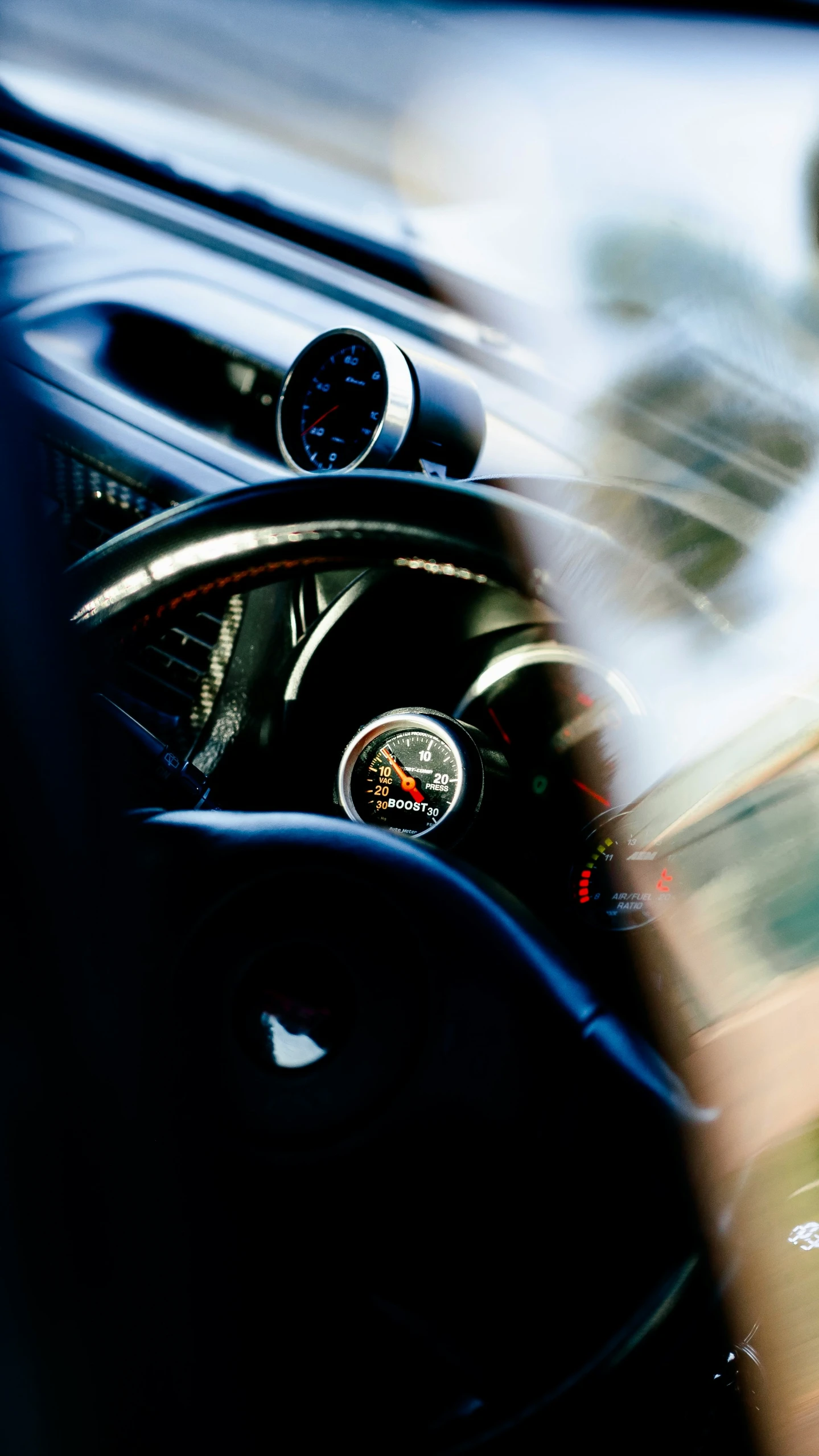 dashboard view of vehicle in open city street