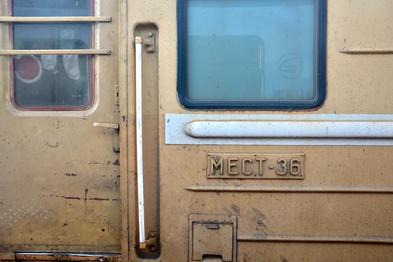 an old train has the door open to let passengers inside