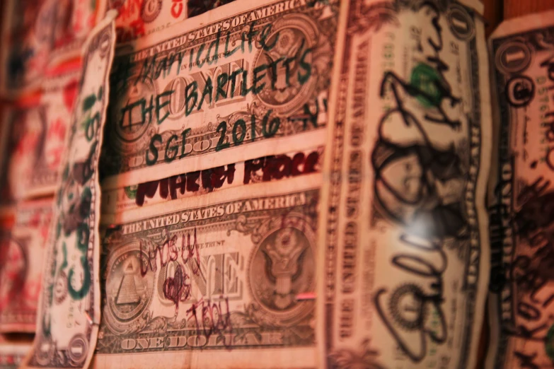 a bank note has been covered with graffiti
