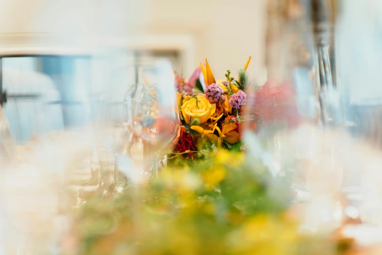 closeup of the top of several tables with flowers