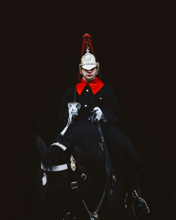 a man dressed in costume sitting on top of a horse