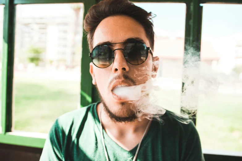 a man with a cigarette sticking out of his face