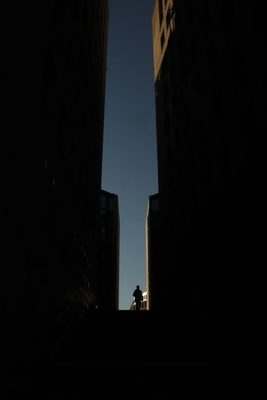 the back of two buildings in the dark