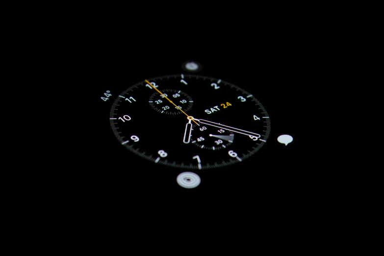 the front of a watch with black background