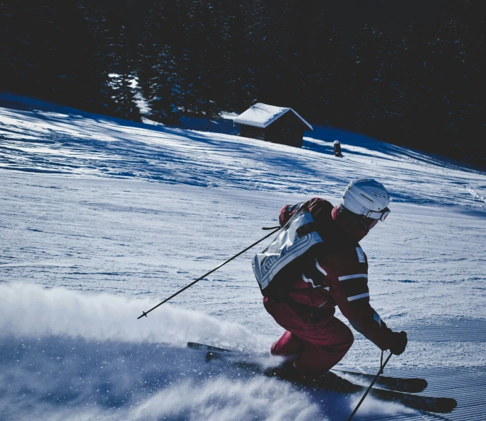 the skier is attempting to ski downhill during the day