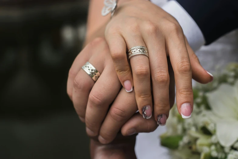 a man and woman are holding hands