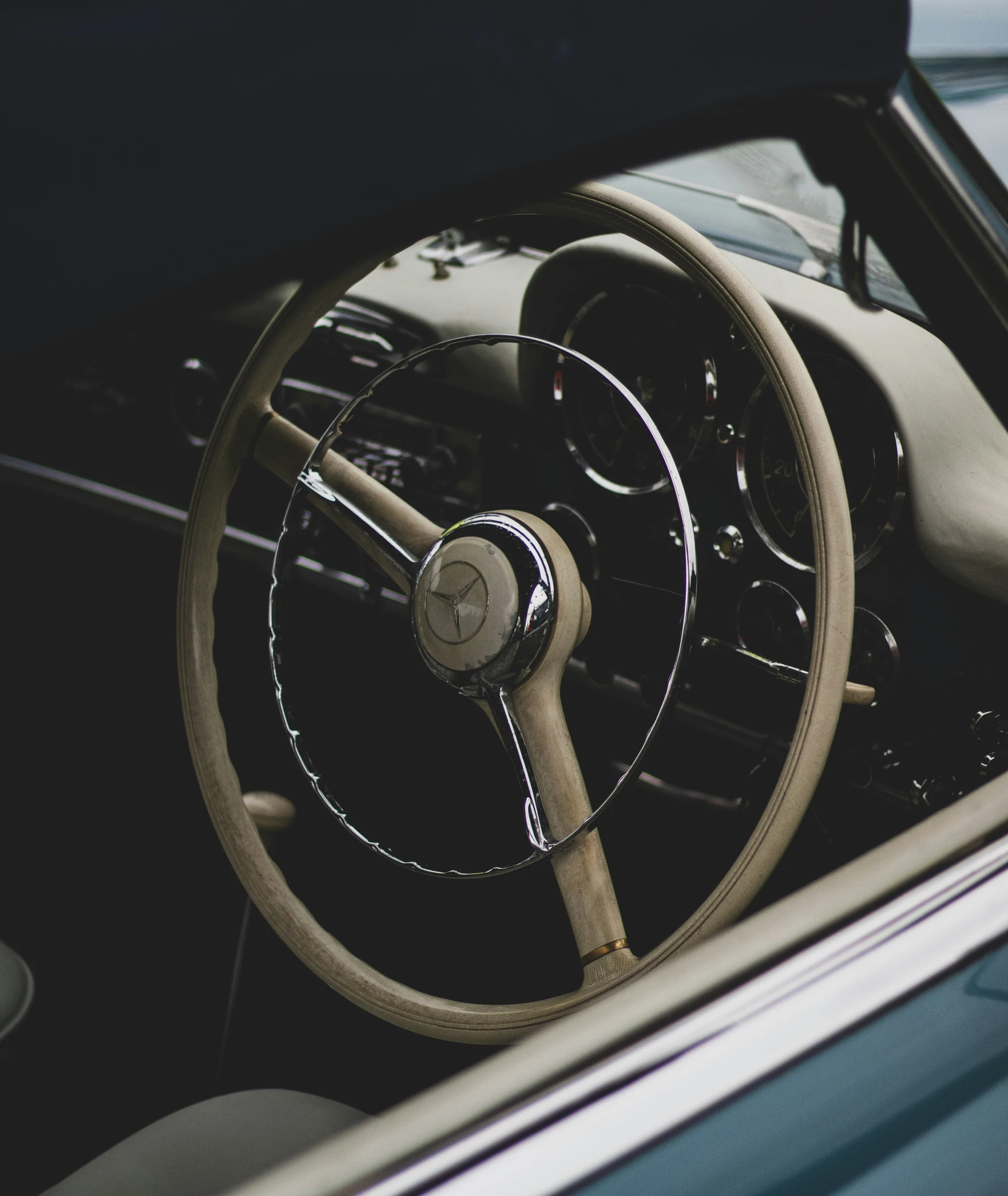 the dashboard of a car with leather steering wheel