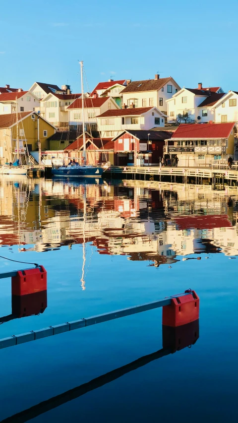 boats sit in the water at a marina