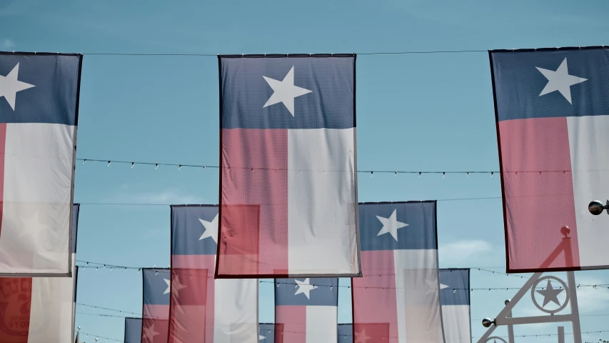 patriotic american flags being hung from clothes line