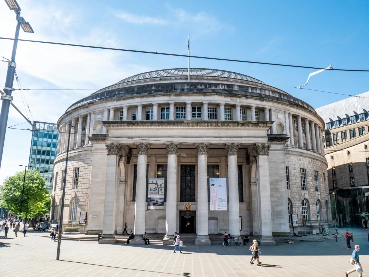 this building has two large circular pillars in front