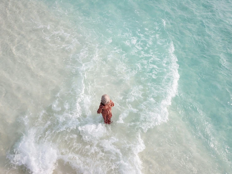 a woman with a bathing suit in the ocean