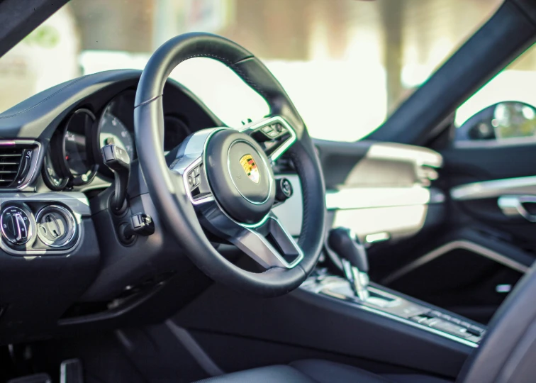 a steering wheel and dashboard of a sport car