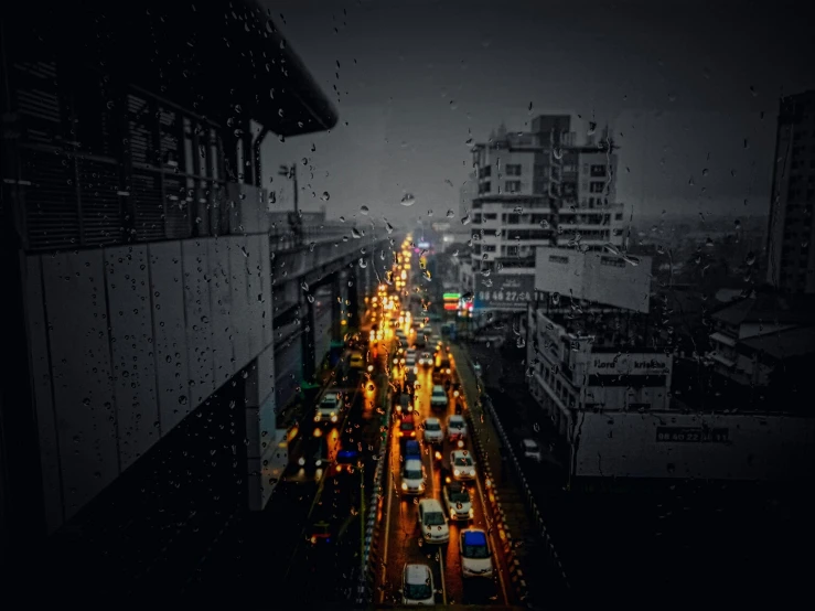 view of an urban road at night with some traffic