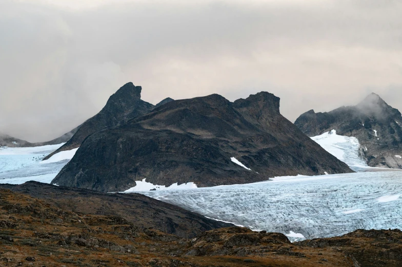 a snowy mountain range with many mountains on the other side