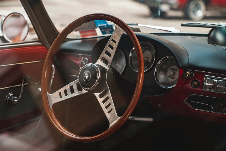 dashboard of an old classic car with wood trim