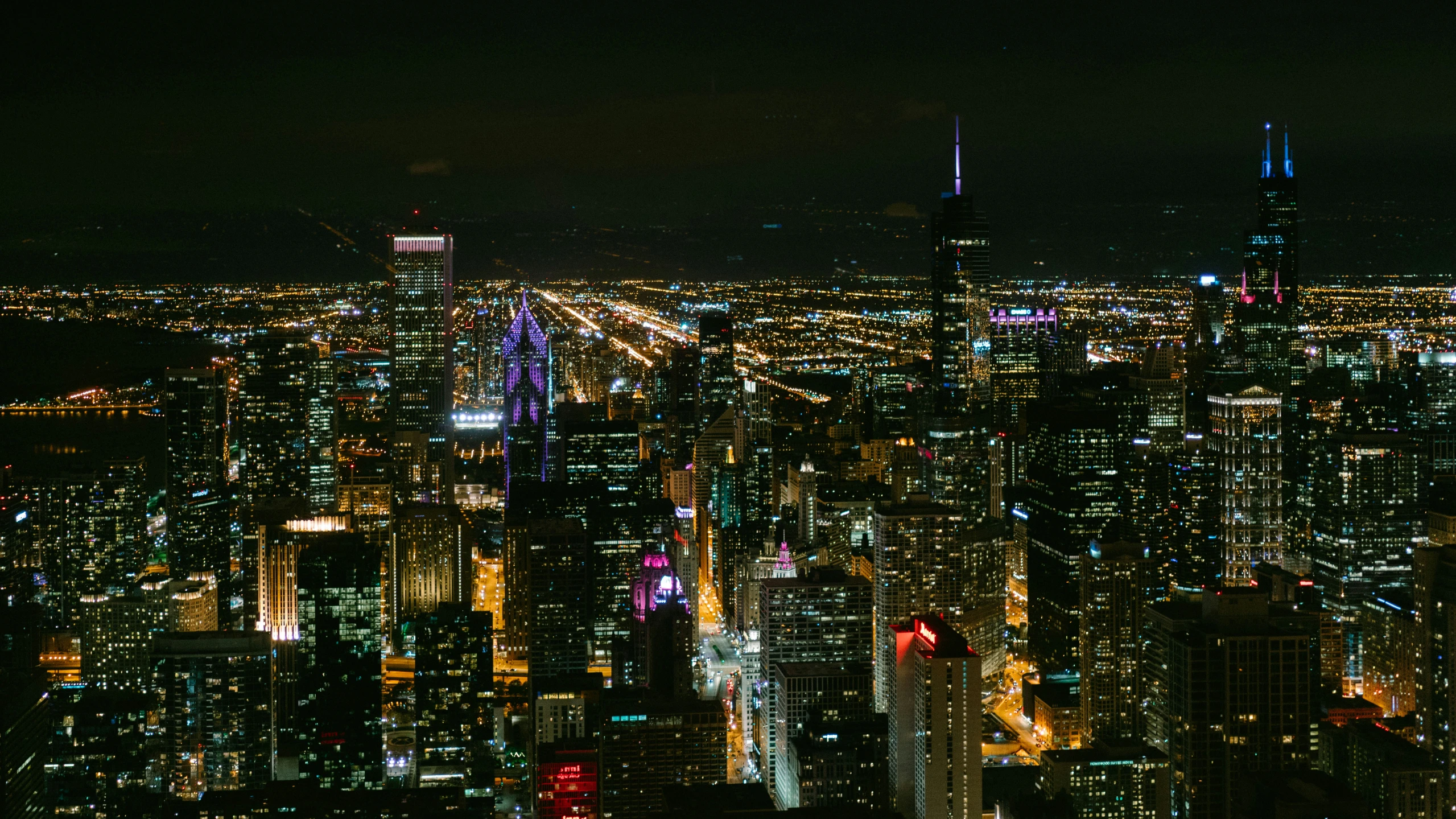 a wide s of the city lights and buildings