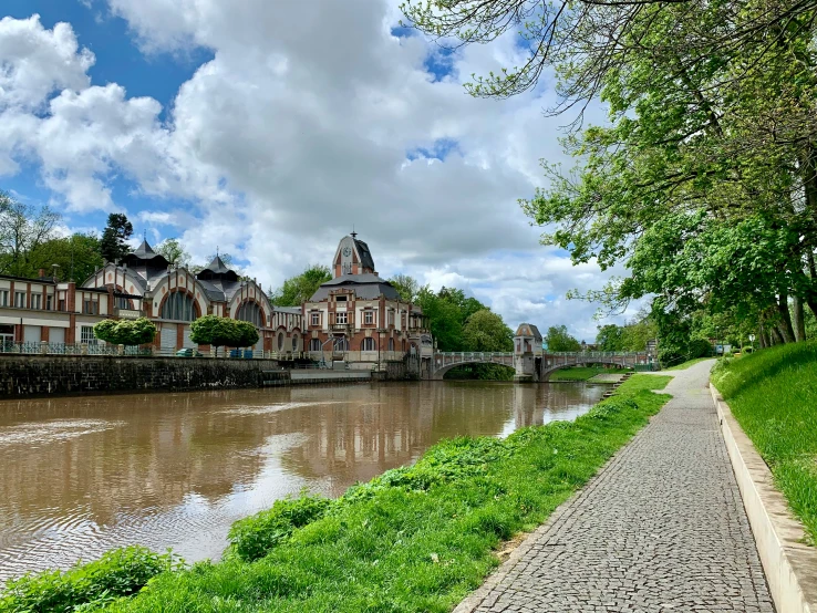 a canal with houses on it on the bank