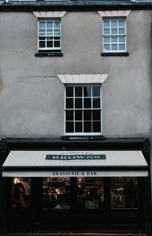 the restaurant has two windows that look over the building