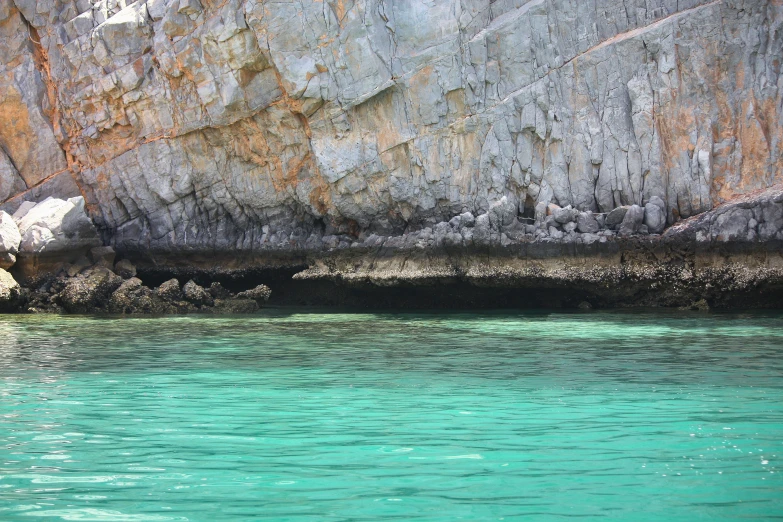 a po of a large rock that is partially submerged in water