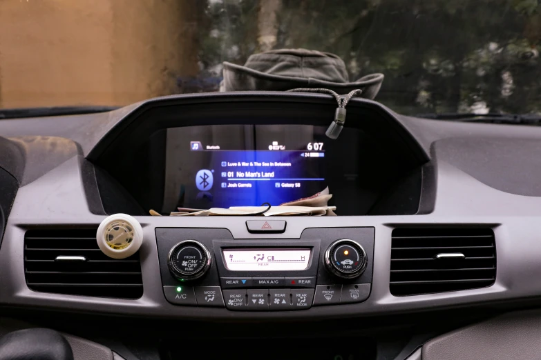 a dashboard showing a car radio with a monitor