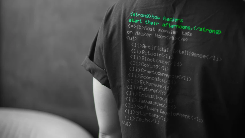 the back of a person's shirt with code code printed on it