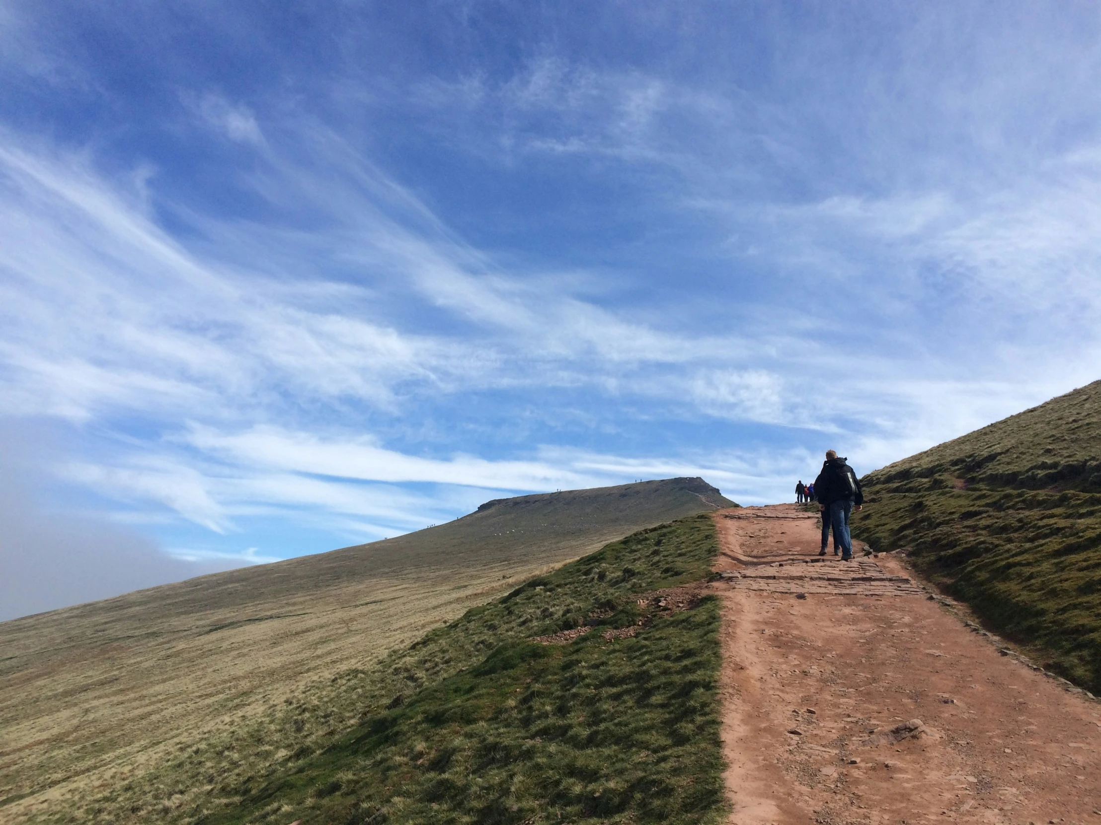 person standing on top of the hill looking down