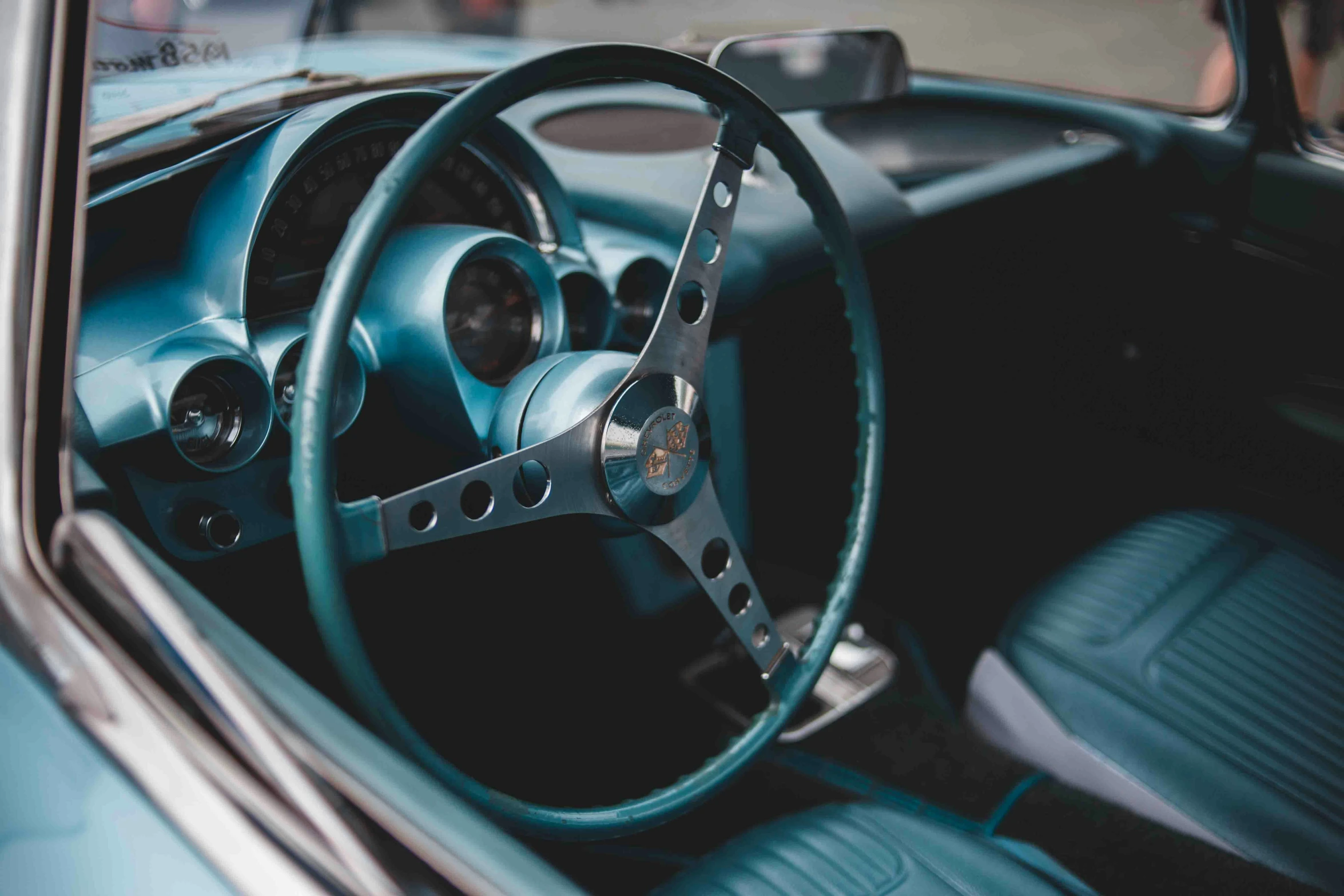 a blue car interior with a steering wheel