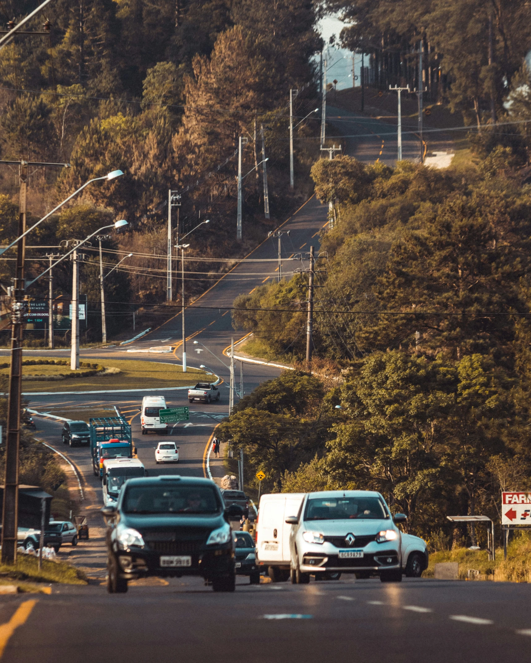 a city street filled with traffic and traffic lights