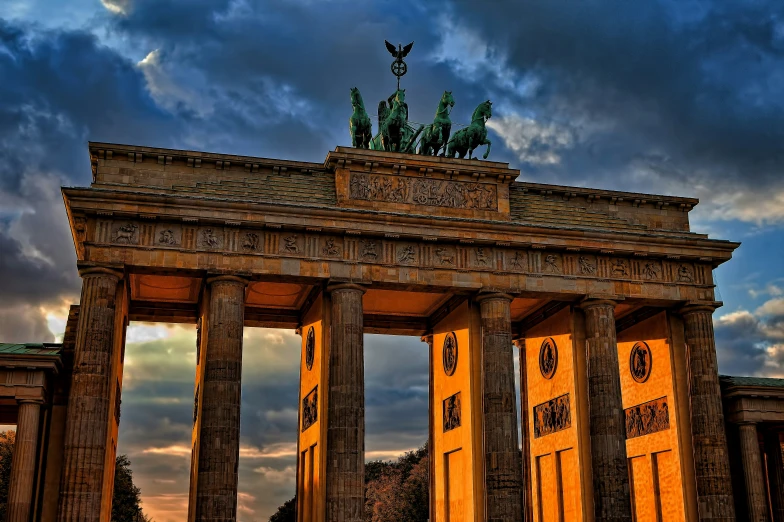 a large monument is illuminated at night time