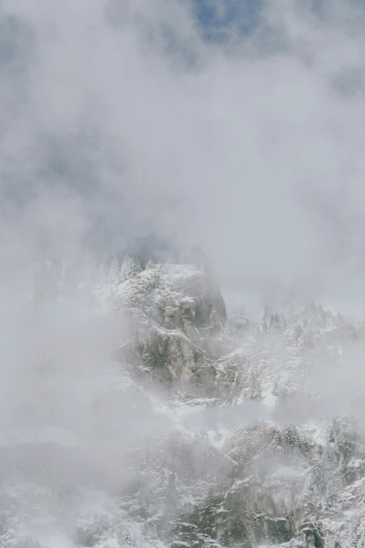 the mountains have thick clouds as a foggy day