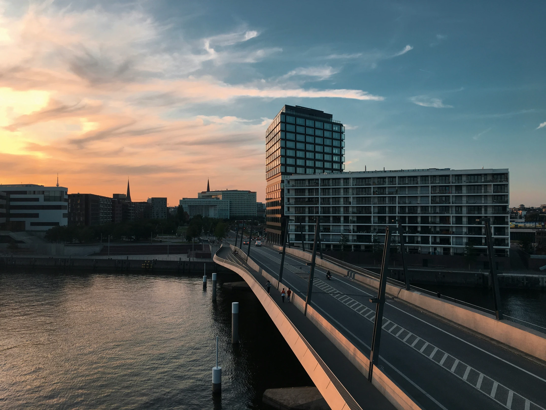 sunset from across the road of a city street