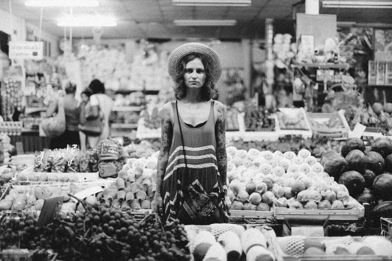 an old po of a woman in the produce section