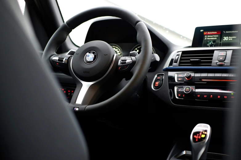 the inside of the dashboard of an automobile with touchscreens