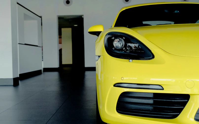 the front view of a yellow sports car