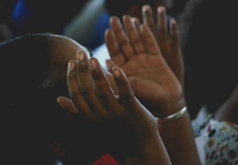 hands in prayer with focus on the palm