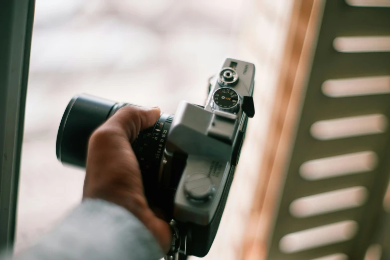 an image of someone using a camera that is on display