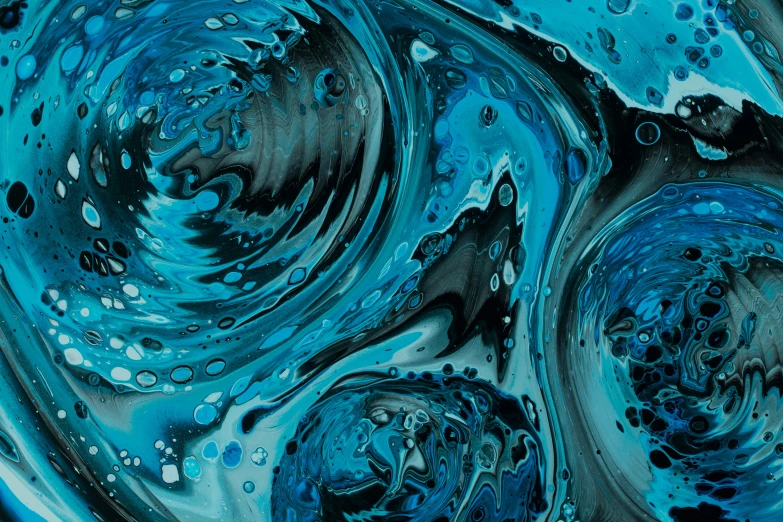 water bubbles floating around in a mixture of blue and black