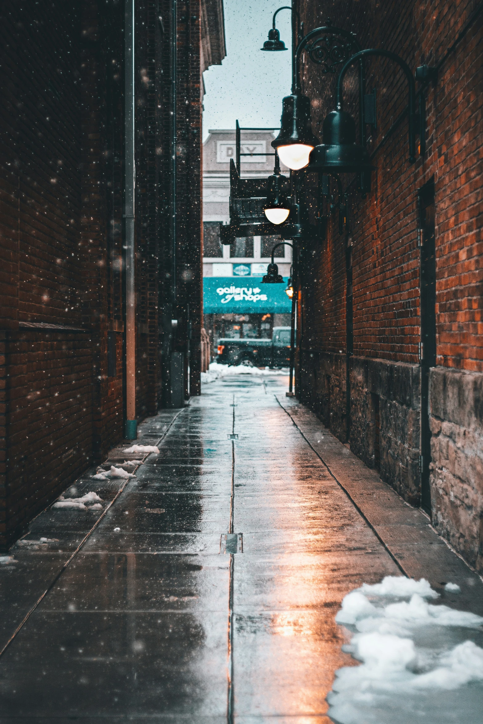 the view of an alley way in the snow