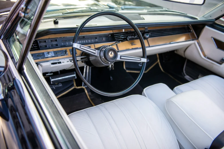 an interior view of a vintage car with leather seats