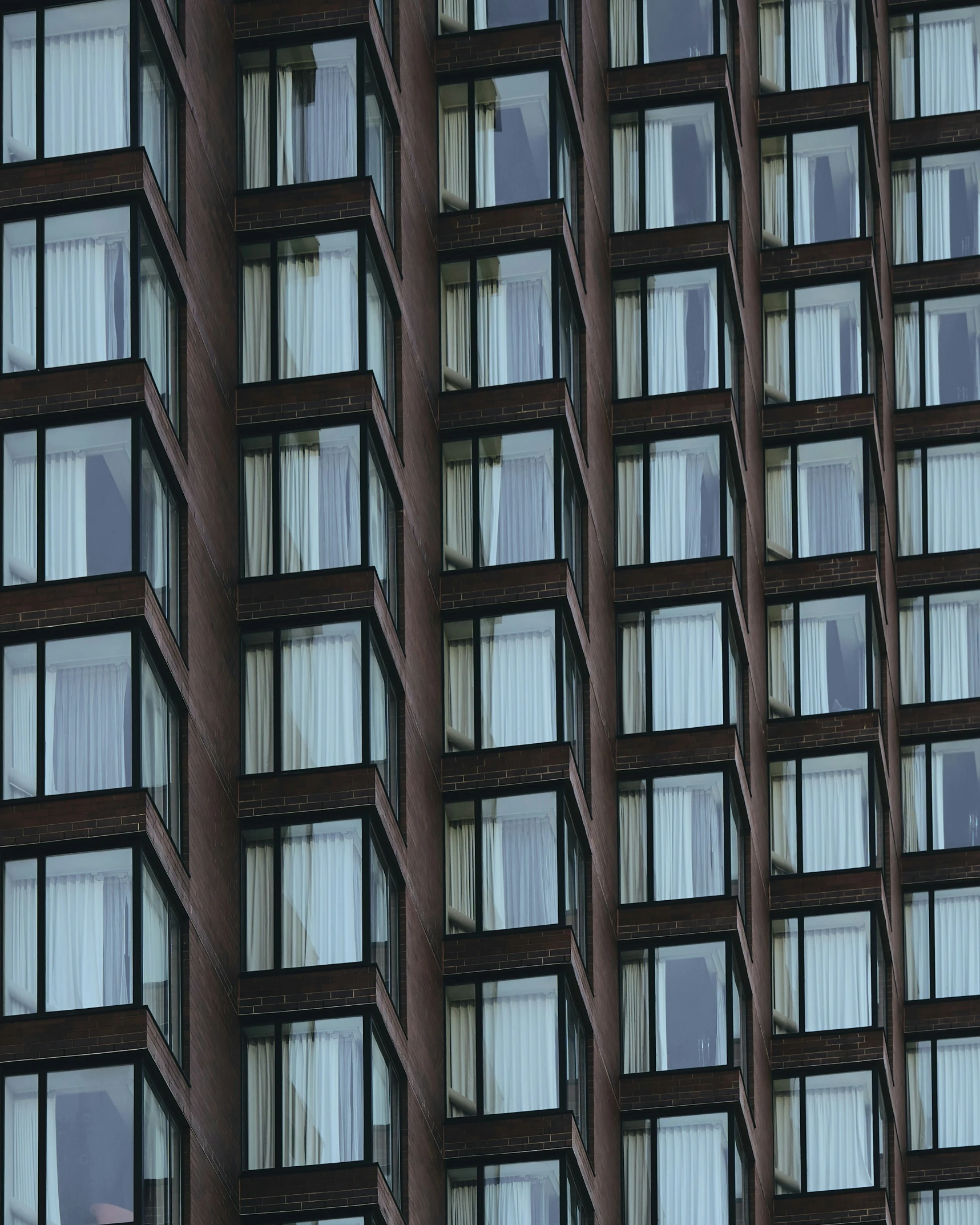 a view of a large building that has many windows on each side