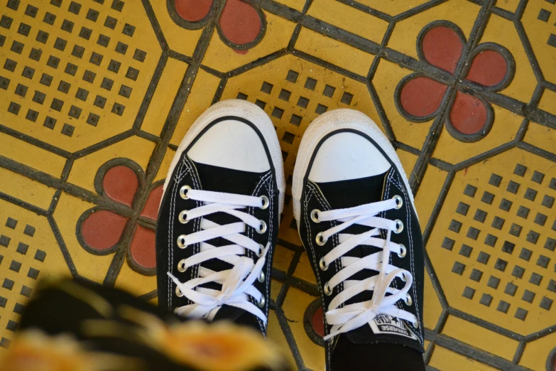 black and white shoes on the floor with red heart patterns