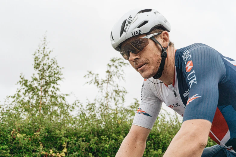 a cyclist is posing on his bike for the camera